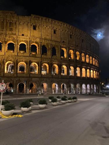 a large building with a lot of lights in it at La Casa di Ludovica all'Appio Latino in Rome