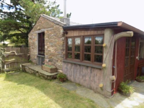 a small house with a slide in the backyard at Cabaña Bioxana in Molejón