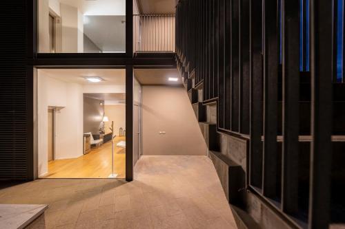 a hallway of a house with a hallway leading into a room at La Villa - Luxury Guest House in Trento