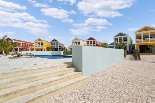 a resort with stairs and houses on the beach at Casa Blue Marlin in Kralendijk