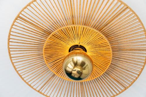 a ceiling light with a large orange fan at Casa Blue Marlin in Kralendijk