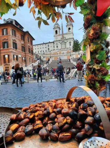 a pile ofnuts in a basket on a city street at La Casa di Ludovica all'Appio Latino in Rome
