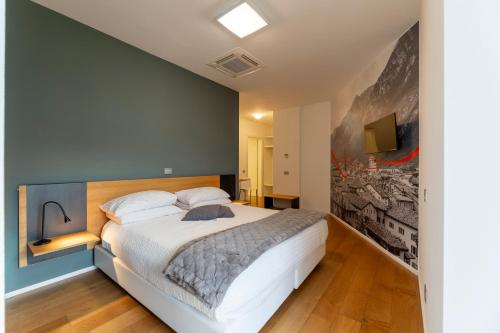 a bedroom with a large white bed in a room at La Villa - Luxury Guest House in Trento
