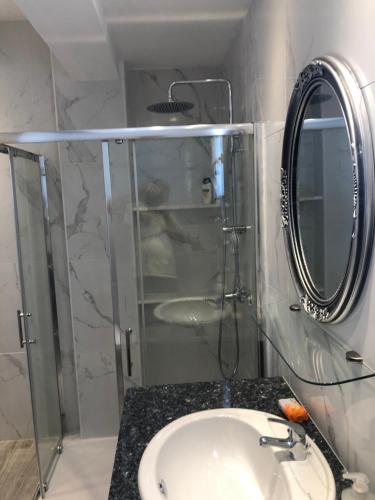 a bathroom with a sink and a mirror at Katerina in Ayia Napa