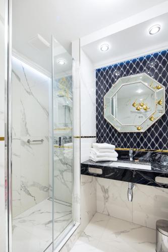 a bathroom with a glass shower and a sink at Hotel Royal Baltic 4* Luxury Boutique in Ustka