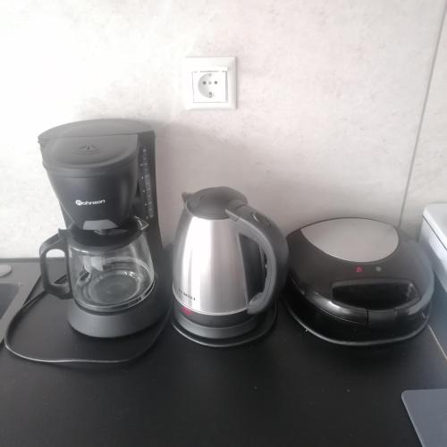 a coffee maker and a blender on a counter at 55sm apartment Voula 4pax in Athens
