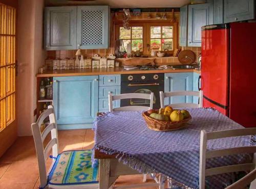 a kitchen with a table with a bowl of fruit on it at Villa Bella in Grožnjan