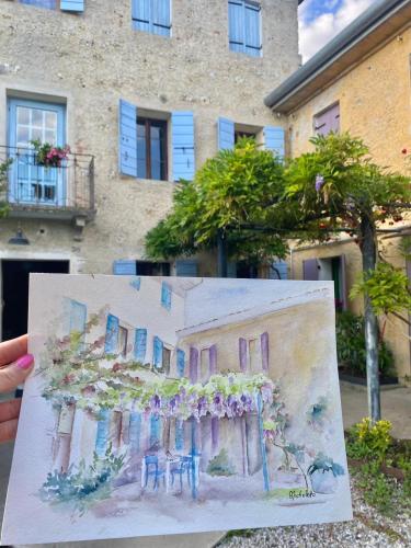 a drawing of a house in front of a building at Casadesergio in Refrontolo