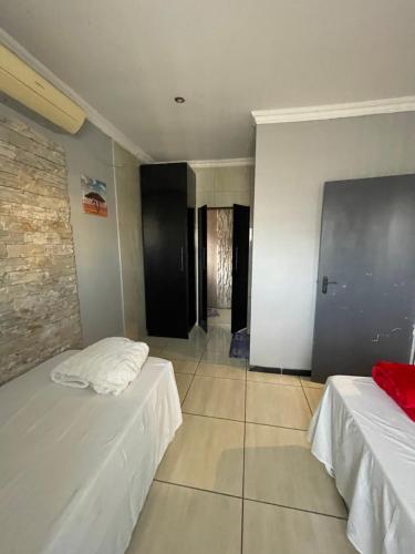 Ένα ή περισσότερα κρεβάτια σε δωμάτιο στο Ayan Contractors & Student Accommodation