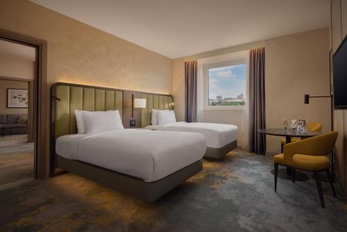 Ένα ή περισσότερα κρεβάτια σε δωμάτιο στο Hilton Sofia