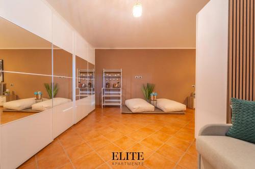 a room with two bean bags on a tile floor at Lussuosa Villa con piscina a Porto Rotondo in Cugnana