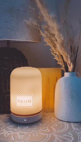 a toaster and a vase sitting on a table at No 1 The Paddock - Spacious holiday home with a hot tub in Bude