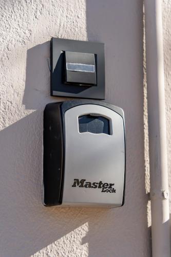 a black and white toaster on the side of a wall at Urban Mountain Retreat in Kroústas