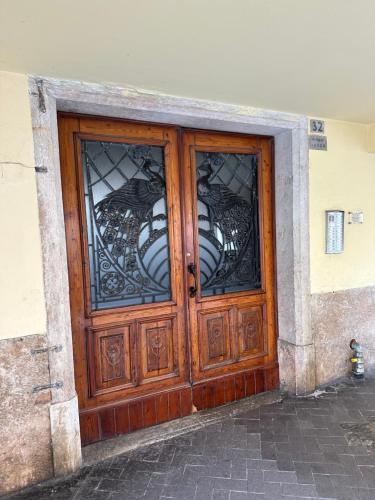 a wooden door with stained glass windows on a building at City Fun in Rovigo