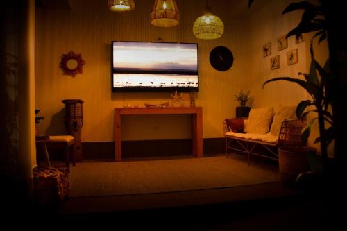 a living room with a flat screen tv and a couch at Norte Cali - Bosque Living- 301 in Cali