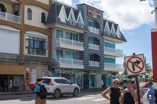 a group of people standing in front of a building at Kings Pavilion Suites Hotel in Basse Terre Town