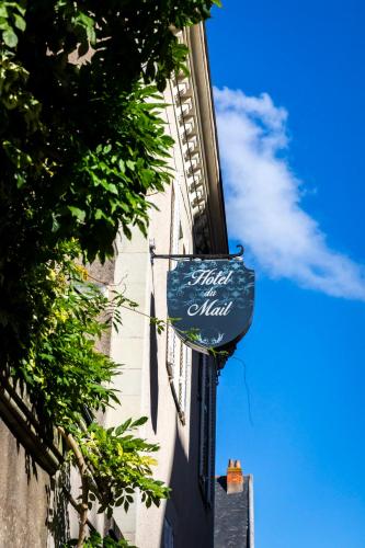 a blue sign on the side of a building at Hôtel du Mail in Angers