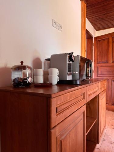 a kitchen with a counter with a coffee maker on it at Penzion Terezka in Králíky