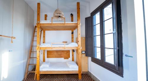 Postel nebo postele na pokoji v ubytování Las Palmas Rooftop Hostel