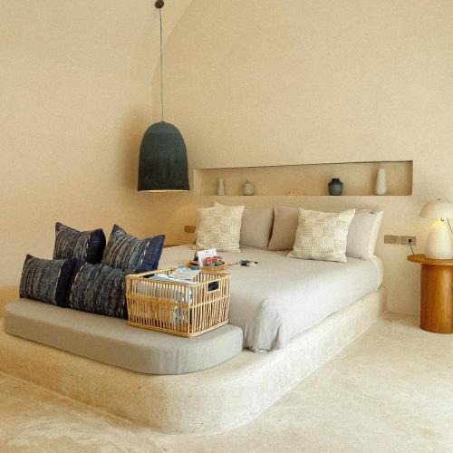 a bedroom with a bed with a basket on it at Rest Sea Resort Koh Kood in Ko Kood