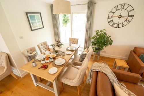 a dining room with a table and chairs at The Heronry Hideaway with luxury hot tub in Ballachulish