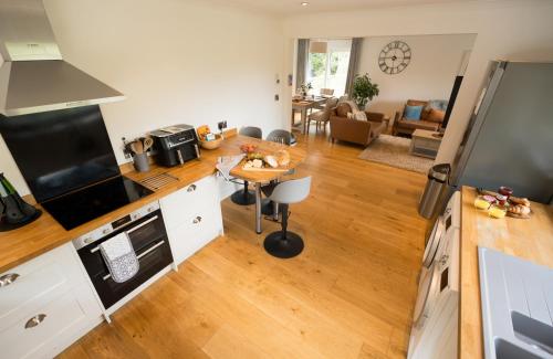 an aerial view of a kitchen and living room at The Heronry Hideaway with luxury hot tub in Ballachulish
