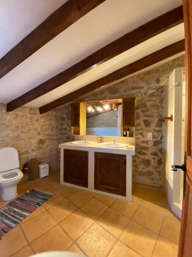 a bathroom with a sink and a toilet at Villas2meet Jimmy Lloret in Lloret de Vistalegre