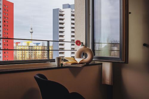 a window with a view of a city skyline at The Circus Living in Berlin
