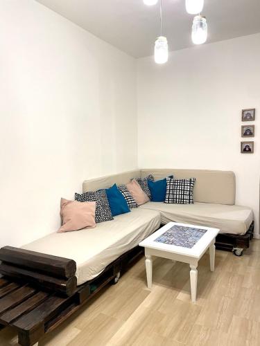 a living room with a couch and a table at La Casetta in Grammichele