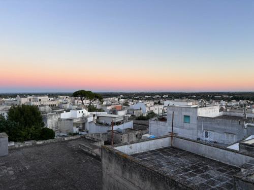 a view from the roof of a building at sunset at La terrazza di Lillo in Carovigno