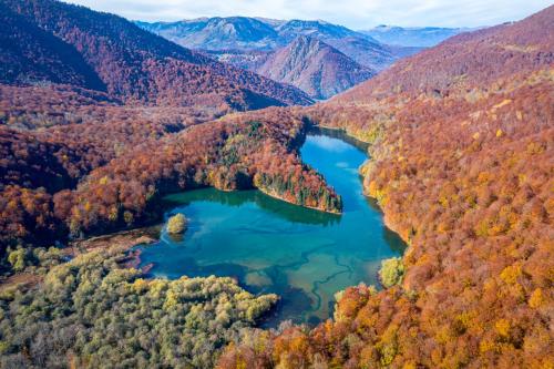 an aerial view of a crater lake in the mountains at Swissôtel Resort Kolasin in Kolašin