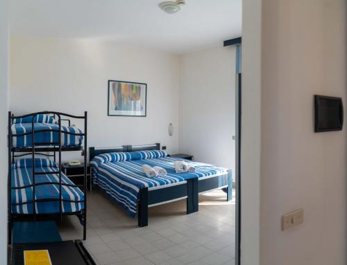 Postel nebo postele na pokoji v ubytování Hotel dei Focesi