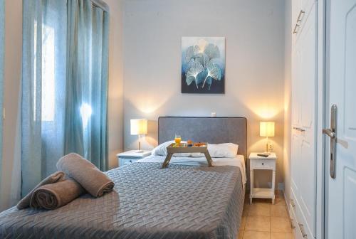 a bedroom with a bed with a table on it at Manesko house in Gaios
