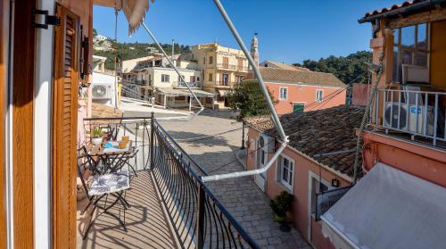 a view of a street from a balcony at Manesko house in Gaios