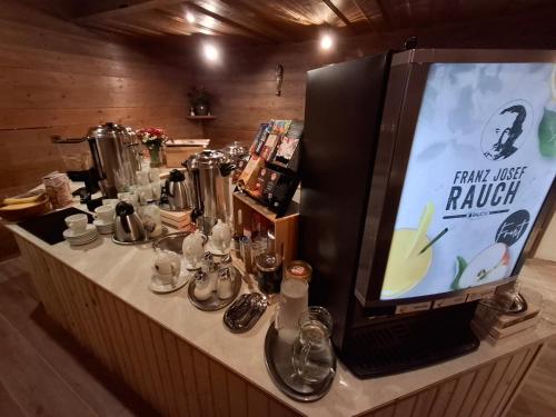 a table with a tv on top of it at Pension Razil in Ladis