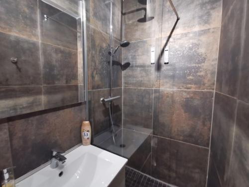 a bathroom with a shower and a sink and a shower at Lafayette Gare Saint-Charles in Marseille