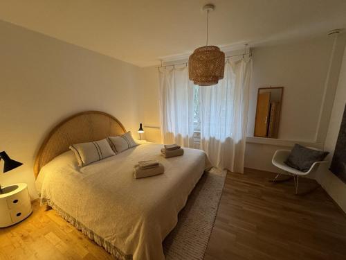 a bedroom with a large bed and a window at Wiembachallee in Leverkusen