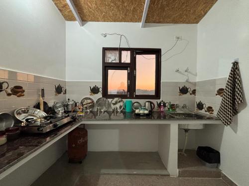 Η κουζίνα ή μικρή κουζίνα στο Bluestar homestay