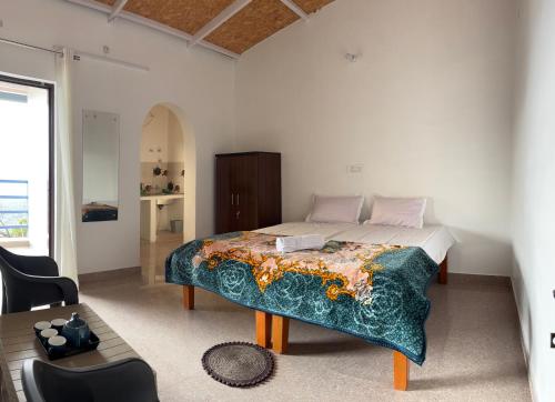 Ένα ή περισσότερα κρεβάτια σε δωμάτιο στο Bluestar homestay