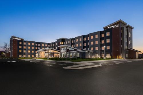 an empty parking lot in front of a building at Residence Inn by Marriott Mechanicsburg in Enola