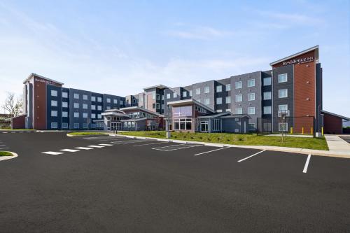 an empty parking lot in front of a building at Residence Inn by Marriott Mechanicsburg in Enola