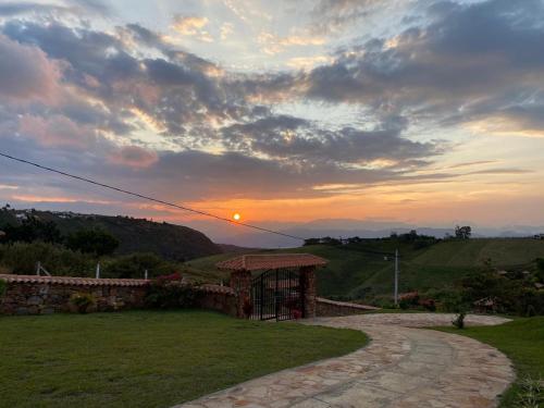 a gazebo in a field with a sunset in the background at Villa Nikitina in Los Santos