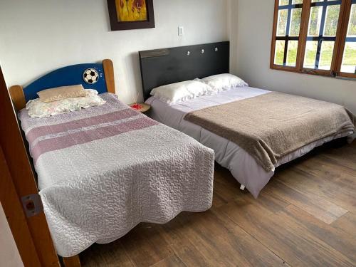two beds sitting next to each other in a bedroom at Villa Nikitina in Los Santos