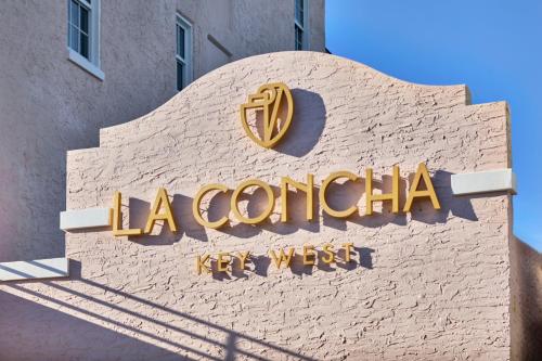 a sign for a restaurant on the side of a building at La Concha Key West, Autograph Collection in Key West