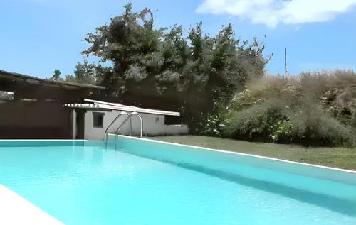 a swimming pool in front of a house at Villa spacieuse à Cannes-et-Clairan avec piscine privée in Cannes-et-Clairan