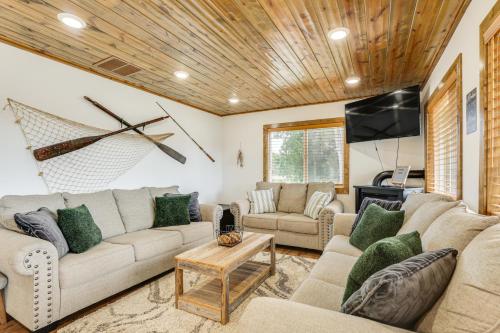 a living room with a couch and a table at Riverfront Home with Private Dock in Wisconsin Dells in Lyndon Station