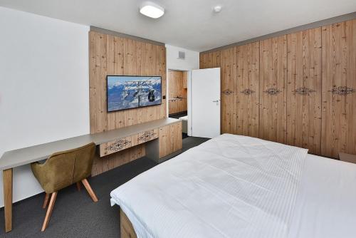 Postel nebo postele na pokoji v ubytování Apartmány Tri sestry Jasná
