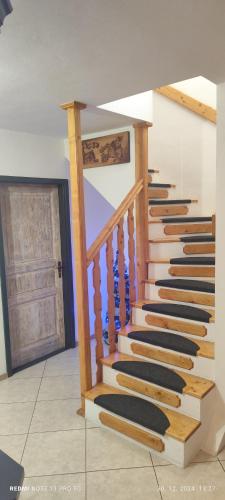 a set of stairs in a room with a door at Guest House Zuzana in Habovka