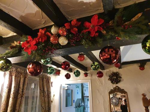 a room with christmas decorations on the ceiling at Apple Blossom Guesthouse in Rempstone