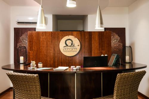 an office with a desk with a laptop on it at Margaritaville Beach Resort Playa Flamingo in Playa Flamingo
